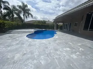 Natural stone pool deck surrounding a South Florida swimming pool — project 09