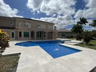 Natural stone pool deck surrounding a South Florida swimming pool — project 10