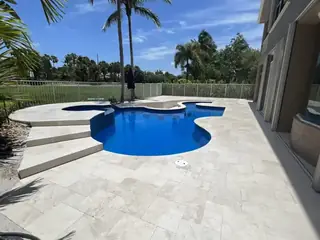 Natural stone pool deck surrounding a South Florida swimming pool — project 14