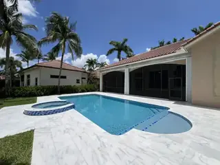 Natural stone pool deck surrounding a South Florida swimming pool — project 15