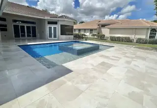 Natural stone pool deck surrounding a South Florida swimming pool — project 20