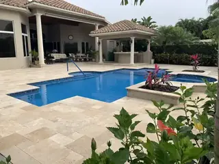 Natural stone pool deck surrounding a South Florida swimming pool — project 40