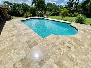 Natural stone pool deck surrounding a South Florida swimming pool — project 50