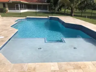 Pool resurfacing project with a blue swimming pool finish — project 09